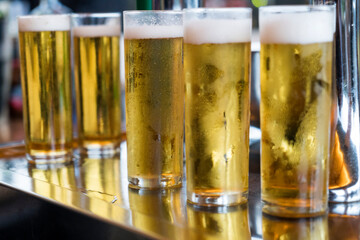 five refreshing, cold glasses of beer