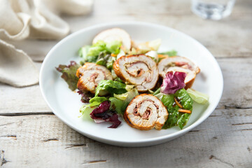 Homemade chicken roulade with salad