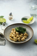 Baked chicken meat with spinach and lime