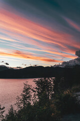 colorful sunset over the lake and trees
