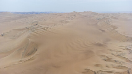 Aerial view of the dunes in the Ica desert in Peru