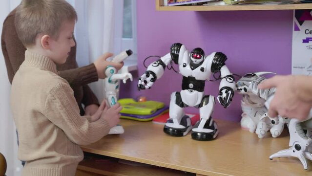 children play with robots on the table
