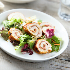 Homemade chicken roulade with salad