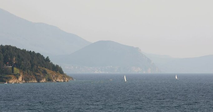 Sailboats cruise on lake Ohrid, Macedonia.