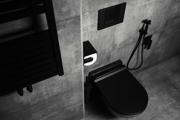 Top view of black matte bathroom details, with dark dark walls. Modern interior.