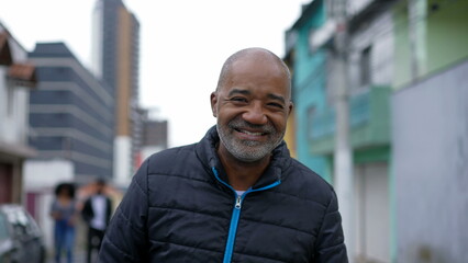 Obraz premium A Brazilian black person walking forward outside in urban street