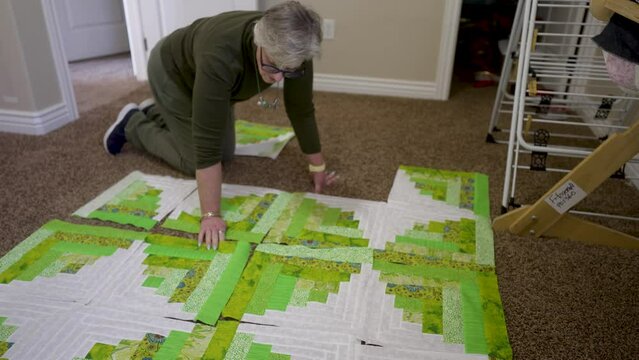 Laying out large quilt blocks before sewing them together - time lapse