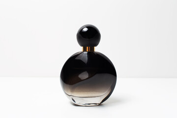 Close-up of black perfume bottle on white background. - Powered by Adobe