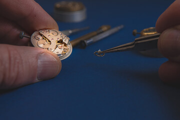 Process of repair mechanical watches.Watchmaker's workshop, mechanical watch repair. Close-up of a...