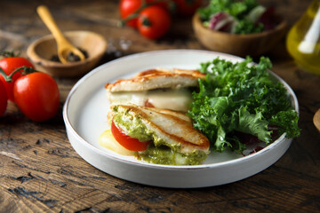 Chicken stuffed with pesto, tomato and cheese