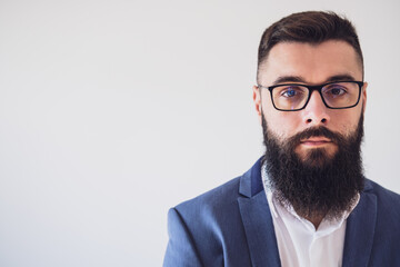 Portrait of pensive businessman. Copy space on image for your text or advert.