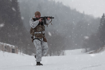 Soldier in winter camouflaged uniform in Modern warfare army on a snow day on forest battlefield with a rifle. Model face very similar to Ukraine prime minister.