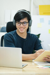 Young man study in front of the laptop computer at home