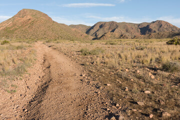 Mountain road in the desert of Cabo de Gata, Almeria. Natural Park. Hiking. Travel. Geology. Volcanic. Andalusia 