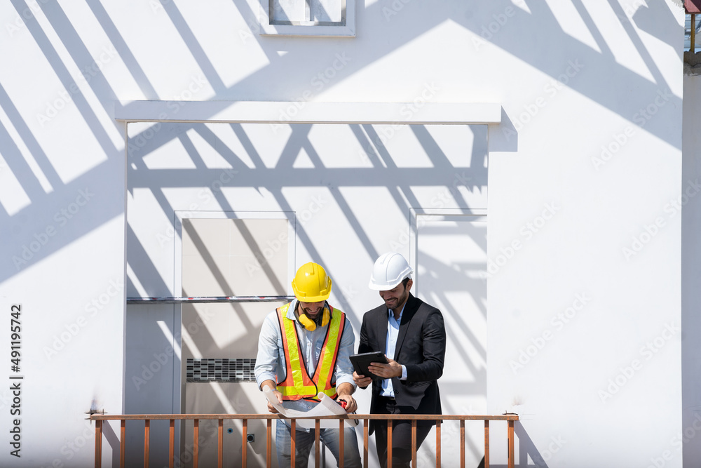 Aufkleber Engineers are discussing data working and tablet or laptop with architectural project at new construction site,Engineering tools and construction concept.