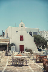 Dining out restaurant in Mykonos. Sightings of Mykonos Island in Greece are of vivid whitewashed houses with vibrant blue doors and window frames