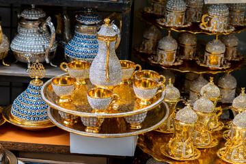 Gift tea and coffee sets decorated with fake diamonds. SPice Bazaar or grand Bazaar, stanbul. selective Focus