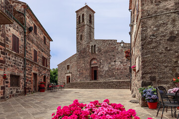Church San Pietro Apostolo (13th-century) in the center of Radicofani town in the summer. Tuscany,...