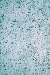 raindrops on the grey metal surface