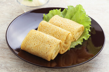 Stuffed pancakes with meat and cream