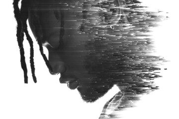 A double exposure portrait of a man combined with digital art.
