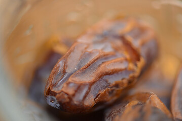Dried dates fruits close up. Delicious food. Local name is: Hurma, macro view