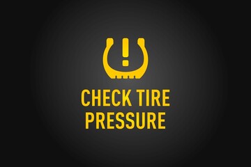 Check Tire Pressure warning on a black background