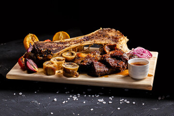 on a kitchen wooden cutting board, fried on a fire, thigh bone with marrow, shish kebab meat, bowl...