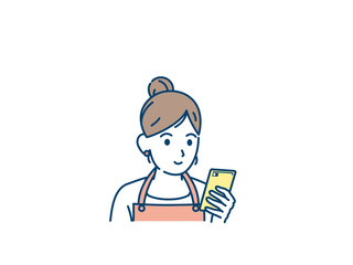 スマートフォンを使う主婦　スマホを見る女性　携帯電話　スマホ　眺める　画面を見る