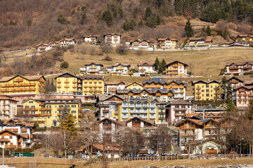 Obraz premium Molveno village, tourist resort on the coast of the lake Molveno, Italian Alps, Brenta Dolomites, National Park of Adamello Brenta. Trentino Alto Adige, Trento, Italy, Europe.