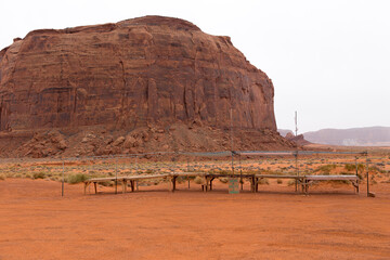 Empty arts and crafts vending stalls in the Monument Valley Navajo Tribal Park seen during an overcast winter afternoon, Arizona, USA