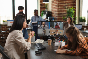 Woman in business video call conference meeting communicating to company colleagues new financial project idea. Finance agency employee presenting to work team profitable marketing methods.