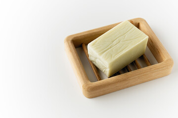 natural handmade soap, on a wooden stand and white background