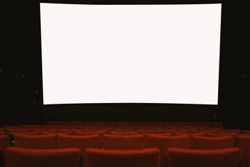Movie theatre with empty armchairs and empty movie screen