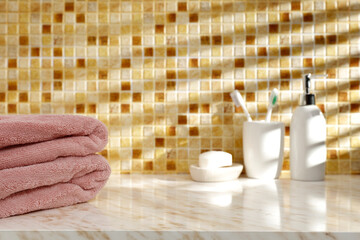 Stone table in the bathroom, with free space, rays of light and shadows on the wall 