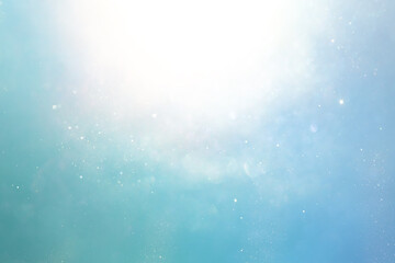 background of abstract blue and silver glitter lights. defocused