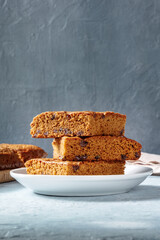 Blondie brownie dessert bars with chocolate chips, a side view with a place for text