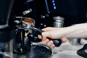 person filling a glass