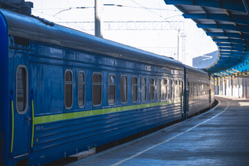 Central railway passenger station of the city of Dnepr. Ukrainian railway. The electric train stands on the platform of the main station, waiting for departure to the route
