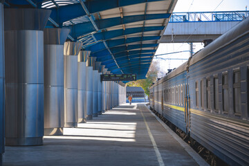 Central railway passenger station of the city of Dnepr. Ukrainian railway. The electric train stands on the platform of the main station, waiting for departure to the route