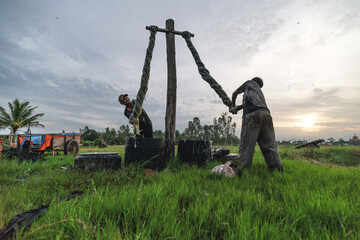 Vietnamese Worker Dye the fabric in Traditional Process in Vietnam