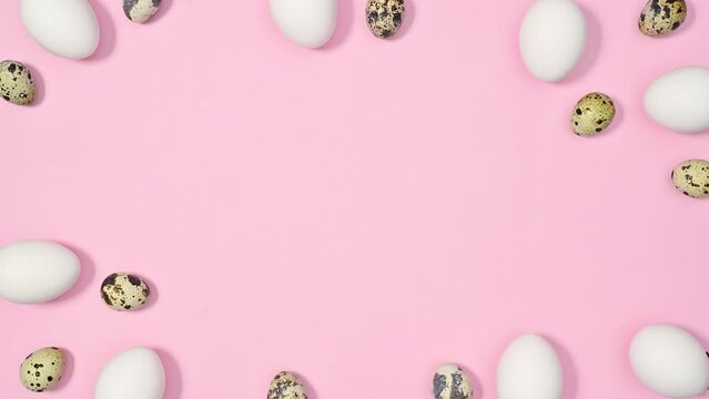 Easter stop motion pastel pink background with quail and white chicken eggs appear. Creative copy space frame
