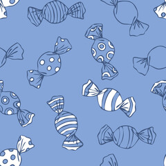 Seamless vector pattern with wrapped candy on blue background. Simple hand drawn sweets wallpaper design. Decorative cartoon fashion textile.