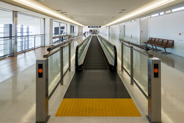 Empty moving sidewalk in vacant airport terminal  - 491215960