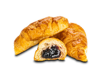 Pile of delicious croissants and a half with blueberry jam on white background.