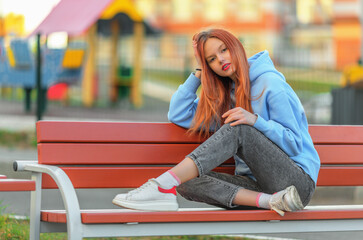 Teen girl in hoodie and jeans - 491216963