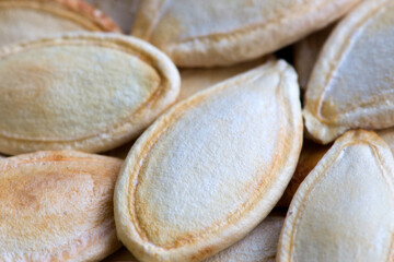 Pumpkin seeds roasted. Dry fruit background. Selective focus.