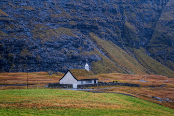 Dramatic november landscape. View of Saksun church, Faroe Islands. Splendid morning scene of Streymoy island, Denmark, Europe. 2021