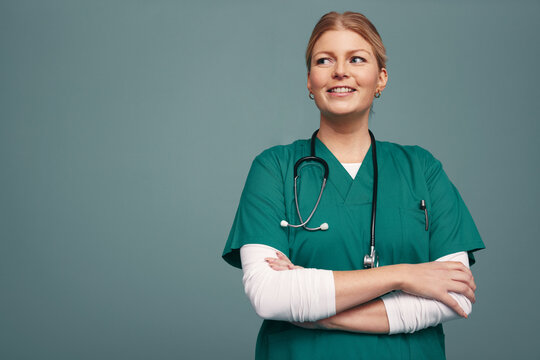 Medical doctor looking away thoughtfully in a studio