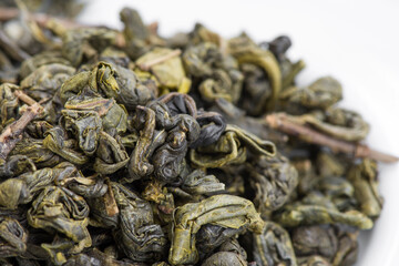 Dried Oolong tea leaves. Prepared for aromatic and curative tea, includes antioxidants. Selective focus.